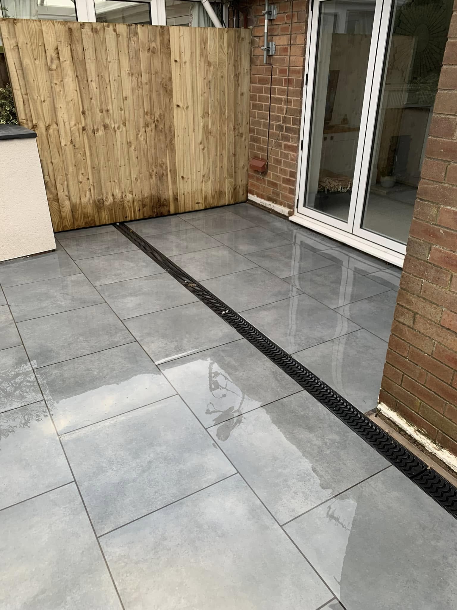 Grey patio with drainage system