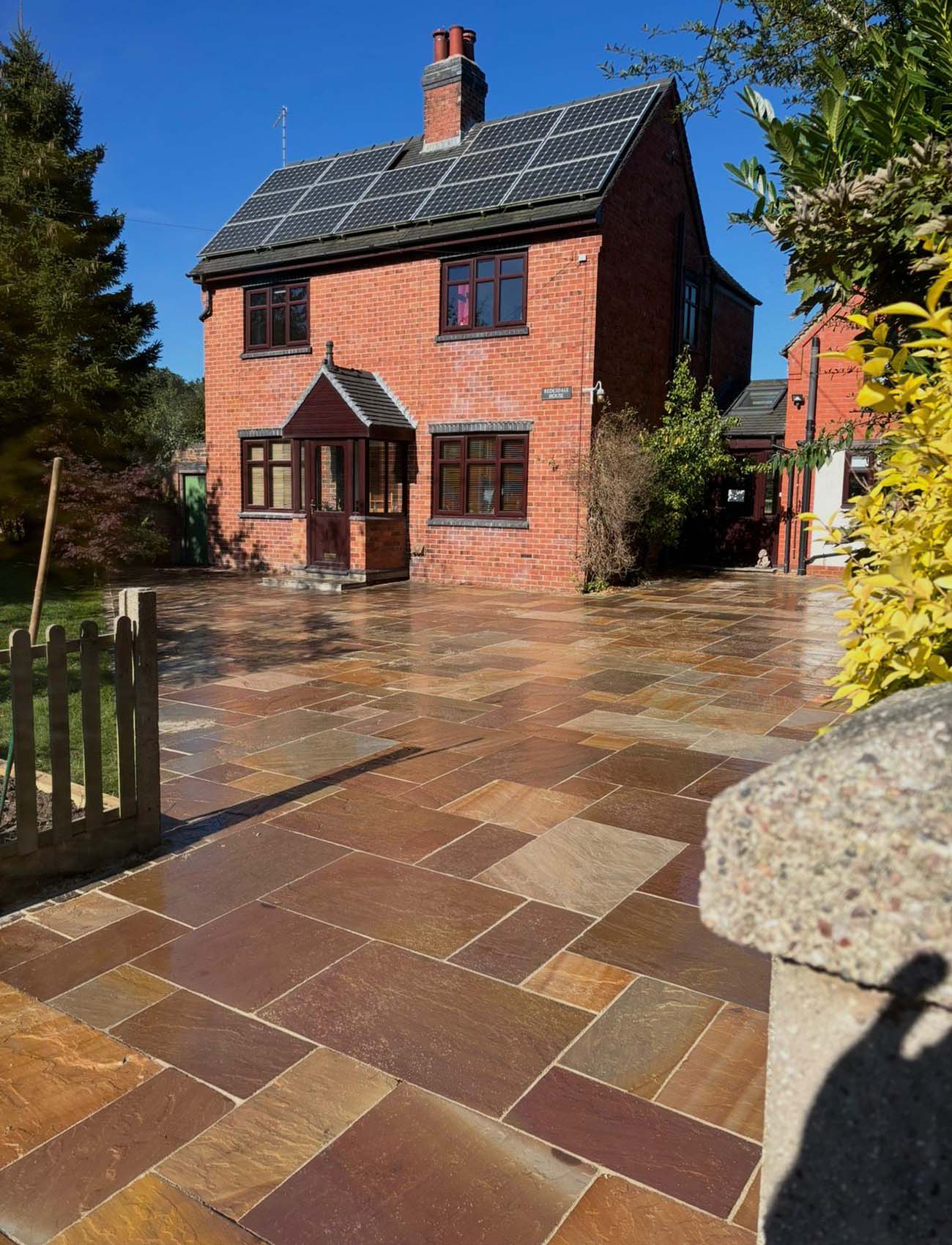 Stone patio driveway of large home